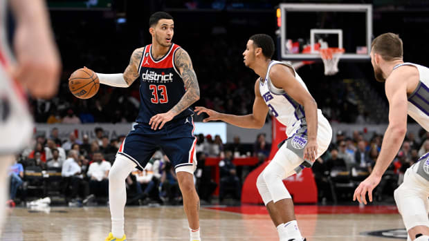 Washington Wizards forward Kyle Kuzma (33) dribbles as Sacramento Kings forward Keegan Murray (13) defends during the second half at Capital One Arena.